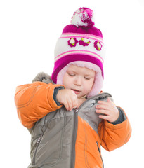 Wall Mural - Adorable toddler girl dressing winter jacket and hat