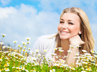 Wall Mural - Happy girl enjoying daisy flower field