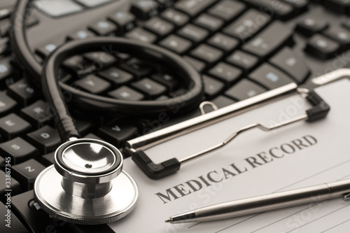 Fotografie, Obraz Doctor's stethoscope and medical record on computer keyboard