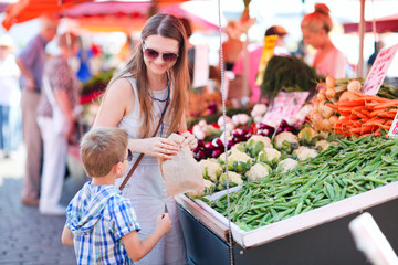 Mother and son at market