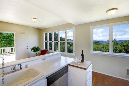 Kitchen With Bright Windows And Lots Of Empty Room Buy This