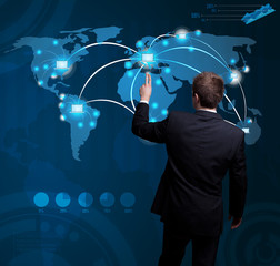 man hand pressing digital button on futuristic map