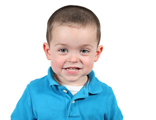 Cute little boy posing for camera on white background