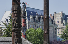 Totem Poles In Front Of The Fairmont Empress Hotel In Victoria,