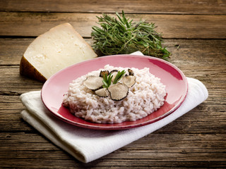 Wall Mural - risotto with truffle over red dish