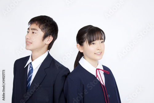 背中合わせに立つ中学生男女stock Photo Adobe Stock