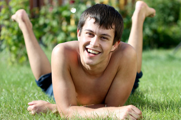 Wall Mural - Portrait of young attractive man, outdoors