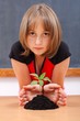 © Szasz-Fabian Erika - Serious elementary schoolgirl protecting plant
