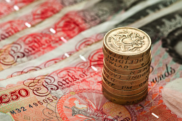 Fifty pounds sterling an coin stack - UK Currency - Macro