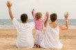 © Rachwalski - Family with hand up are looking the ocean