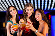 © Kzenon - People with cocktails in bar or club