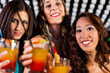 © Kzenon - People with cocktails in bar or club
