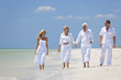© Darren Baker - Two Couples Generations of Family Walking on Tropical Beach