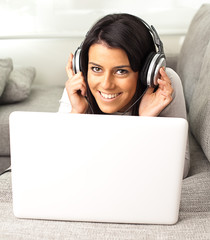 Wall Mural - young woman listen to music