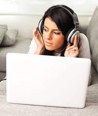 Wall Mural - young woman listening to music