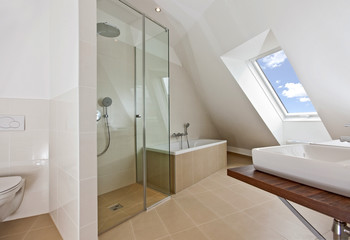 sunlit bathroom with roof top window