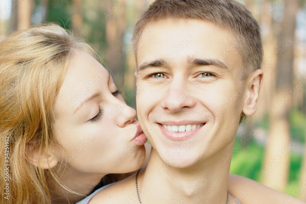 Teenage Girl Kissing Her Boyfriend Stock Photo Adobe Stock teenage-girl-kissing-her-boyfriend-stock-photo-adobe-stock