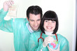 cheerful medical duo wearing blouse with globe