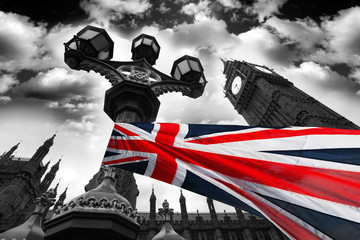 Big Ben with colorful flag of England, London, UK