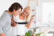 © WavebreakmediaMicro - Couple cooking with a pan