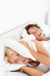 © WavebreakmediaMicro - Portrait of a woman awaken by her husband's snoring