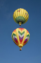 Wall Mural - Two hot-air balloons flying vertically aligned