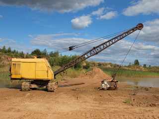 Old yellow excavator.