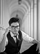 attractive young man in elegant eyeglass in bw retro style