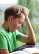 © Denizo - Boy bored with homework