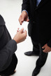© Monkey Business - Detail businessman and woman exchanging cards