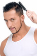 Man with perfect hair using comb brush