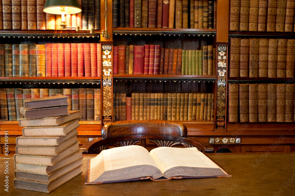 Librarybtable Old classic library with books on table Stock Photo | Adobe Stock