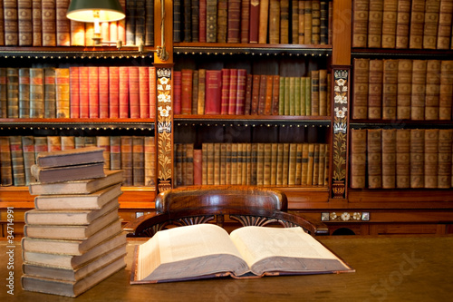 Naklejka na szafę Old classic library with books on table