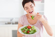 © WavebreakmediaMicro - Smiling woman eating salad