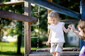 Wall Mural - Father and daughter playing in the park at summer