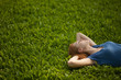 © Nikita Vishneveckiy - girl lying on the grass and sleeping peacefully