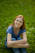 © Nikita Vishneveckiy - beautiful red-haired girl sitting on grass