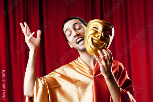 Fotografie, Tablou Actor with maks in a funny theater concept