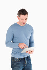Poster - Portrait of a man working with a tablet computer