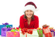 © Ramona Heim - woman with chrsitmas hat between many colorful gifts