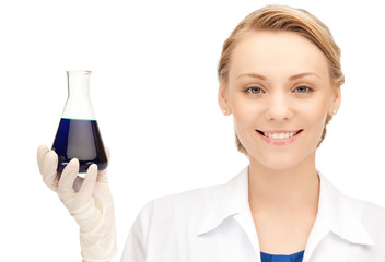 lab worker holding up test tube