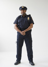 African American Policeman With Hands Clasped