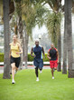 © Erik Isakson/Blend Images - People running in park together