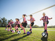 © Erik Isakson/Blend Images - Girl soccer players practicing near net