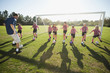 © Erik Isakson/Blend Images - Coach practicing with girl soccer players
