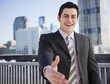 © JGI/Jamie Grill/Blend Images - Hispanic businessman with hand outstretched