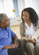 © JGI/Tom Grill/Blend Images - Nurse giving woman checkup