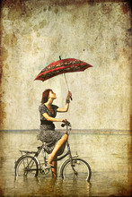 Girl With Umbrella On Bike. Photo In Old Image Style.