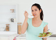 © WavebreakmediaMicro - Lovely young woman with salad in kitchen