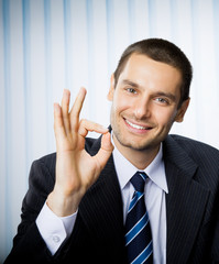 Businessman with okay hand sign at office